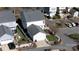 Aerial view of a two story house with a detached garage, white fence and mature trees at 14024 Alley Son St, Huntersville, NC 28078