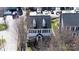 Aerial view of a two story house with dormer windows, dark shutters and a red door at 14024 Alley Son St, Huntersville, NC 28078