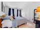 Bedroom featuring a bed with plush bedding, blue curtains, and ample natural light at 14024 Alley Son St, Huntersville, NC 28078