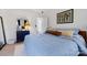 Bedroom featuring a bed with blue bedding and side table with art and bright light at 14024 Alley Son St, Huntersville, NC 28078