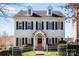 Charming two-story home with dormer windows, black shutters, and a welcoming red front door at 14024 Alley Son St, Huntersville, NC 28078