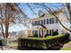 Well-maintained home featuring dormer windows, black shutters, and mature landscaping at 14024 Alley Son St, Huntersville, NC 28078