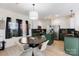 Bright eat-in kitchen featuring an island, modern appliances, and a stylish dining table at 14024 Alley Son St, Huntersville, NC 28078