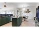 Bright kitchen featuring an island, open layout, and a stylish dining area nearby at 14024 Alley Son St, Huntersville, NC 28078