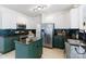 Modern kitchen with stainless steel appliances, stylish backsplash, and a central island at 14024 Alley Son St, Huntersville, NC 28078
