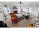 Airy living room with a fireplace and large windows that offers abundant natural light, creating a warm and inviting space at 14024 Alley Son St, Huntersville, NC 28078