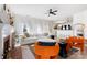 Open living room with a fireplace, bright natural light, and comfortable seating arrangement at 14024 Alley Son St, Huntersville, NC 28078