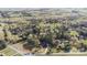 Aerial view of home and property, revealing its serene, wooded location close to the road at 14124 Hiwassee Rd, Huntersville, NC 28078