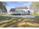 Large backyard with a patio, deck, and spacious concrete area at 14124 Hiwassee Rd, Huntersville, NC 28078