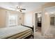 Bedroom featuring a window, closet, bed, and doorway to an adjacent bathroom at 14124 Hiwassee Rd, Huntersville, NC 28078