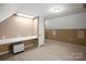Versatile bonus room with desk, carpeting, and neutral paint scheme at 14124 Hiwassee Rd, Huntersville, NC 28078