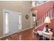 Inviting foyer with staircase, hardwood floors, and natural light at 14124 Hiwassee Rd, Huntersville, NC 28078