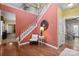 Elegant foyer featuring a staircase, hardwood floors, and stylish decor at 14124 Hiwassee Rd, Huntersville, NC 28078