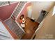 Foyer with hardwood floors and staircase, and a view to the lower level at 14124 Hiwassee Rd, Huntersville, NC 28078