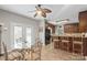 Eat-in kitchen features a table and breakfast bar with wood cabinets and stainless steel appliances at 14124 Hiwassee Rd, Huntersville, NC 28078