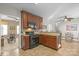 Kitchen showcases dark wood cabinets, black appliances, and easy access to the living room at 14124 Hiwassee Rd, Huntersville, NC 28078