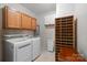 Functional laundry room with appliances, cabinets, and storage shelves at 14124 Hiwassee Rd, Huntersville, NC 28078