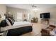Bright main bedroom with hardwood floors, natural light, sitting area, and ceiling fan at 14124 Hiwassee Rd, Huntersville, NC 28078