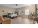 Virtually staged main bedroom with neutral walls, lots of natural light, and a ceiling fan at 14124 Hiwassee Rd, Huntersville, NC 28078