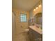 Bathroom featuring a gray vanity, modern fixtures, and bright lighting at 2020 Parkdale Ave, Gastonia, NC 28052