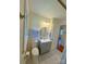 Bathroom featuring a gray vanity, modern fixtures, and bright lighting at 2020 Parkdale Ave, Gastonia, NC 28052