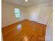 Bedroom featuring a window for natural light and hardwood flooring for a classic look at 2020 Parkdale Ave, Gastonia, NC 28052