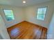 A bedroom offering two windows that allows ample natural light to enter the space at 2020 Parkdale Ave, Gastonia, NC 28052