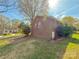 Charming brick home featuring a well-maintained lawn and mature trees in a desirable neighborhood at 2020 Parkdale Ave, Gastonia, NC 28052