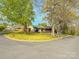 Charming home nestled on a corner lot with mature trees and beautiful landscaping at 2020 Parkdale Ave, Gastonia, NC 28052