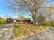 Traditional home with brick accents, a spacious driveway, and a well-maintained lawn at 2020 Parkdale Ave, Gastonia, NC 28052