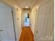 Hallway with hardwood flooring leading to additional rooms at 2020 Parkdale Ave, Gastonia, NC 28052