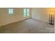 Bright living room with neutral carpet, large windows and natural light at 2020 Parkdale Ave, Gastonia, NC 28052