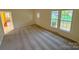 Inviting living room with carpet and a view of the outdoors at 2020 Parkdale Ave, Gastonia, NC 28052