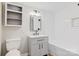 Charming bathroom with a modern vanity, toilet, and tiled tub/shower combo, complemented by stylish fixtures at 209 N Yadkin Ave, Spencer, NC 28159