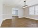 Dining room features wood floors, recessed lighting, and archway at 209 N Yadkin Ave, Spencer, NC 28159