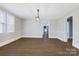Dining room features wood floors and neutral paint colors at 209 N Yadkin Ave, Spencer, NC 28159