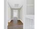 Hallway with wood floors and neutral paint colors throughout at 209 N Yadkin Ave, Spencer, NC 28159