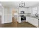 Updated kitchen with stainless steel appliances and granite countertops at 209 N Yadkin Ave, Spencer, NC 28159