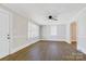Spacious living room showcasing hardwood floors, natural light, and neutral paint tones at 209 N Yadkin Ave, Spencer, NC 28159