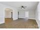 Spacious living room featuring wood floors, archways, and neutral paint colors at 209 N Yadkin Ave, Spencer, NC 28159