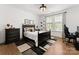 Comfortable bedroom features hardwood floors, a dark dresser, and a black bedframe at 209 Sardis Ln, Charlotte, NC 28270