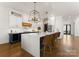 Open concept kitchen with island seating, modern appliances, and pendant lights offering a bright and inviting space at 209 Sardis Ln, Charlotte, NC 28270