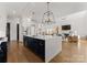 Modern kitchen with navy blue cabinets, white countertops, stainless steel appliances, and an open floorplan at 209 Sardis Ln, Charlotte, NC 28270