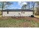 The backyard of this home features a white painted brick exterior at 2120 Green Oak Dr, Shelby, NC 28152
