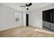 This bedroom features wood floors, a modern ceiling fan, and a window at 2120 Green Oak Dr, Shelby, NC 28152