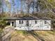 Charming exterior with a painted brick facade, black trim, and a covered porch, offering curb appeal at 2120 Green Oak Dr, Shelby, NC 28152