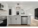 Modern kitchen with white cabinets, stainless steel appliances, and quartz countertops at 2120 Green Oak Dr, Shelby, NC 28152