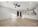 Open-concept living room featuring lots of light and a modern ceiling fan and recessed lighting at 2120 Green Oak Dr, Shelby, NC 28152