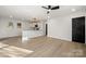 Bright, open-concept living room with updated kitchen and hardwood floors at 2120 Green Oak Dr, Shelby, NC 28152