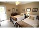 Comfortable bedroom with two beds and access to a deck at 21205 Cold Spring Ln, Cornelius, NC 28031